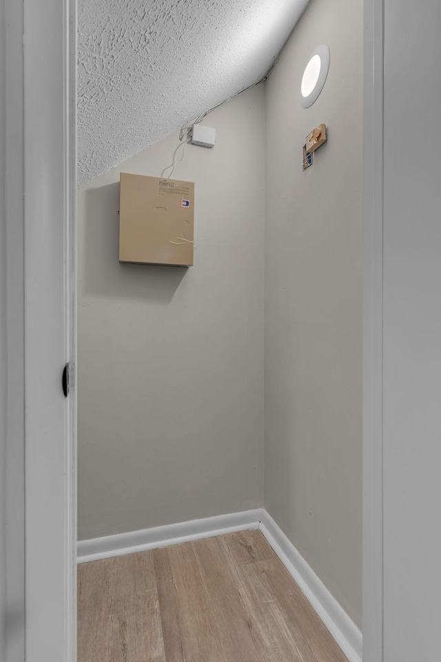 room details featuring wood-type flooring and a textured ceiling