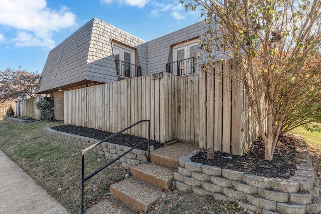 view of side of property with french doors