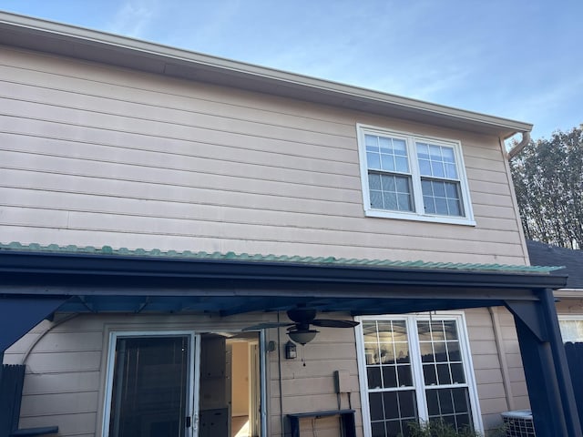 view of home's exterior featuring ceiling fan and central air condition unit