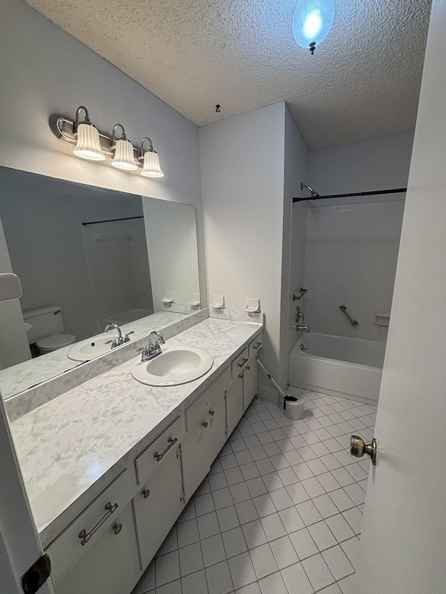 full bathroom featuring tile patterned floors, vanity, a textured ceiling, bathing tub / shower combination, and toilet