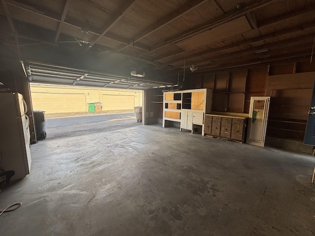 garage with white fridge