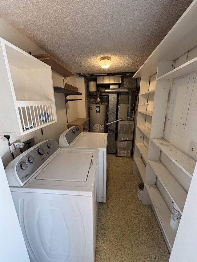 washroom with gas water heater, a textured ceiling, and separate washer and dryer