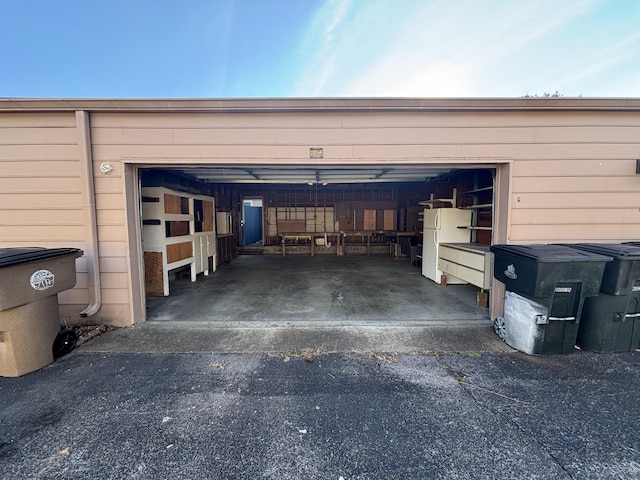 garage with white fridge