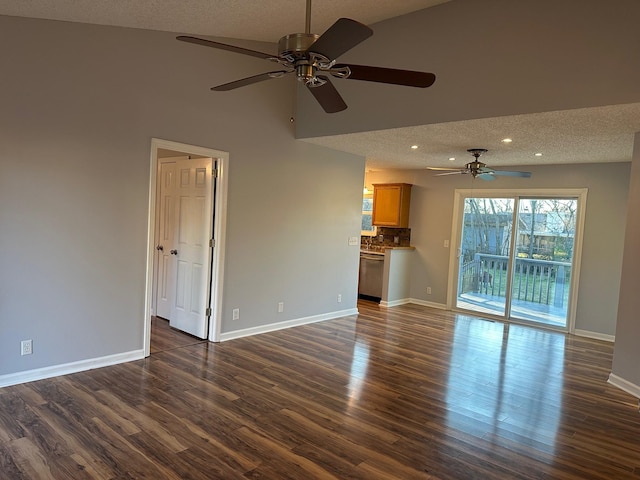 unfurnished living room with ceiling fan, dark hardwood / wood-style floors, and a textured ceiling