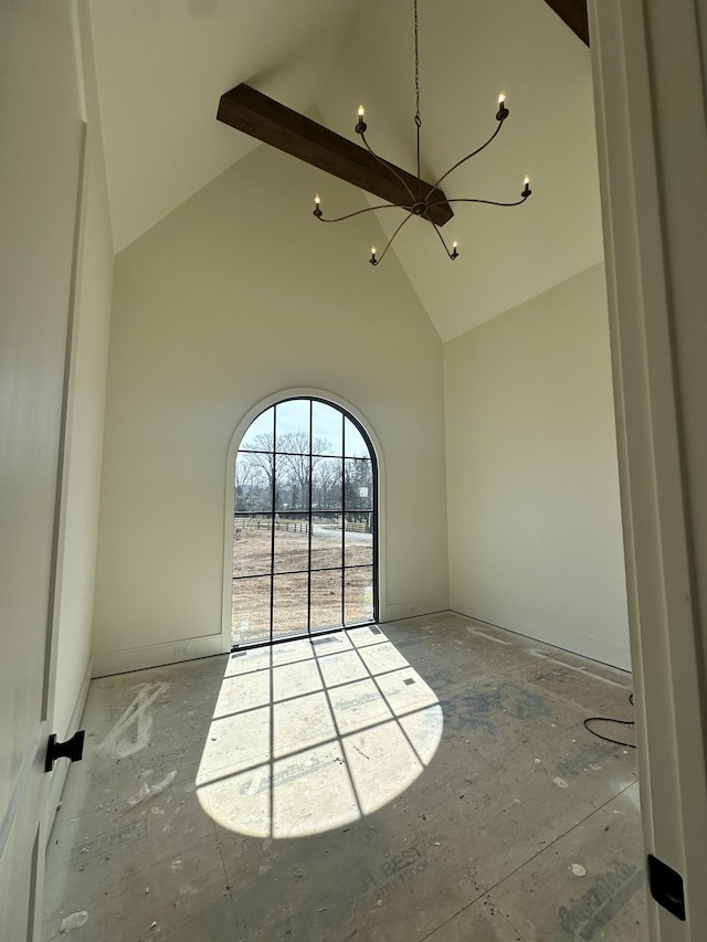 unfurnished room with high vaulted ceiling and beamed ceiling