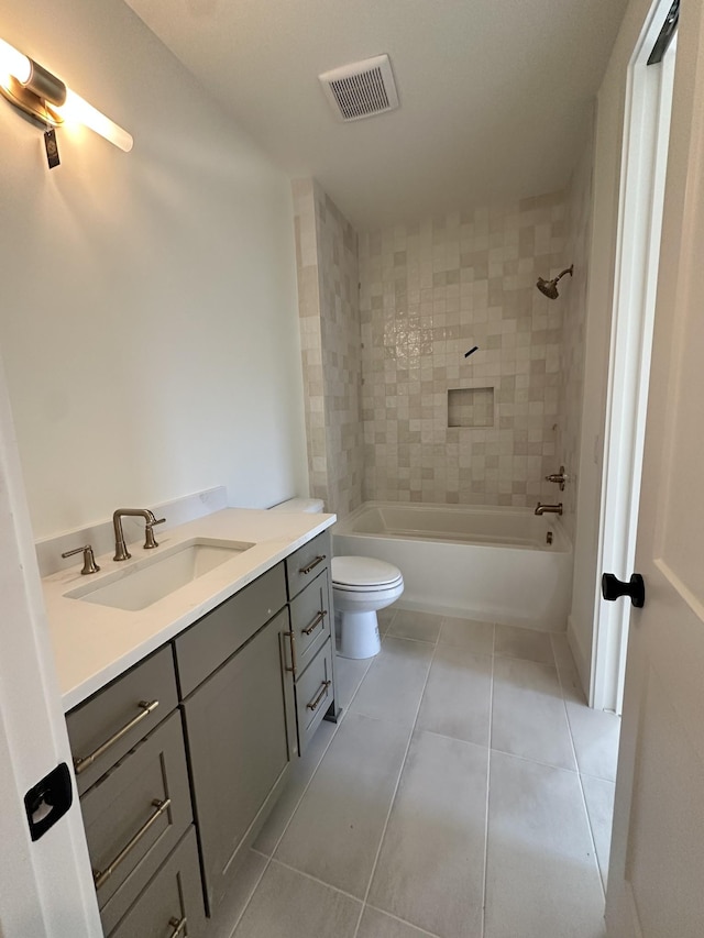 bathroom with tile patterned flooring, toilet, shower / bath combination, vanity, and visible vents