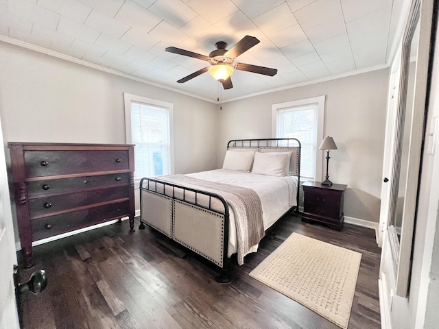 bedroom with multiple windows, ceiling fan, dark hardwood / wood-style floors, and ornamental molding