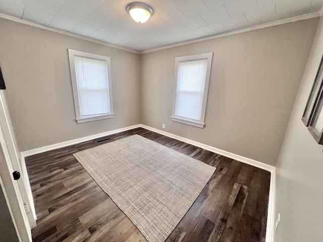 unfurnished room with dark hardwood / wood-style floors and crown molding