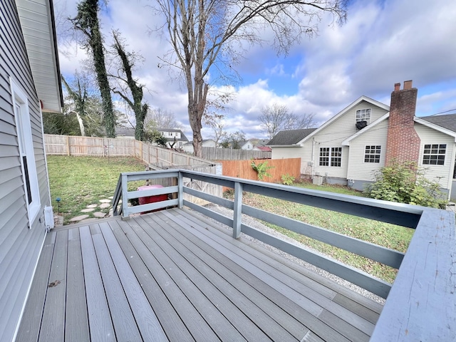 wooden terrace with a yard