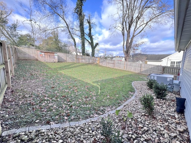 view of yard with central AC unit