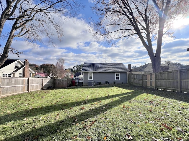 view of yard with central air condition unit