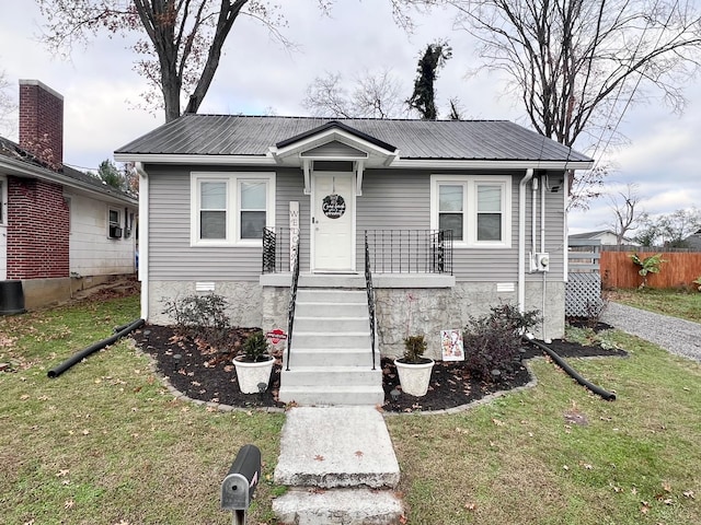 bungalow with a front yard