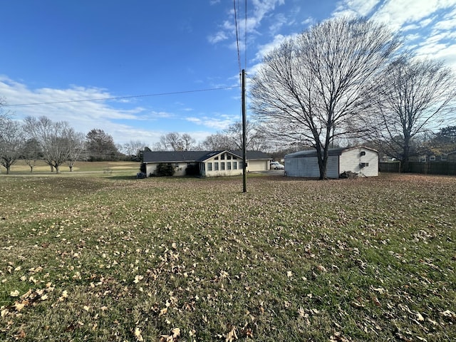 view of yard with a storage shed