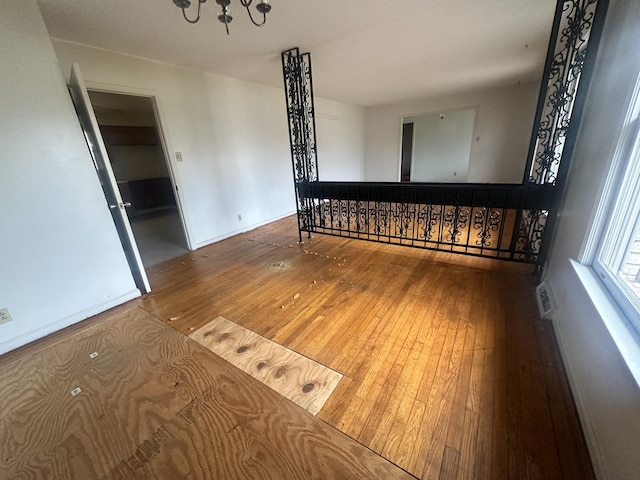 spare room with hardwood / wood-style floors