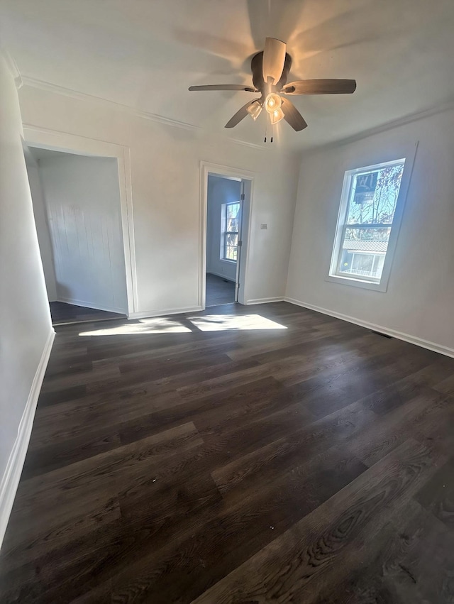 unfurnished room featuring ceiling fan and dark hardwood / wood-style flooring