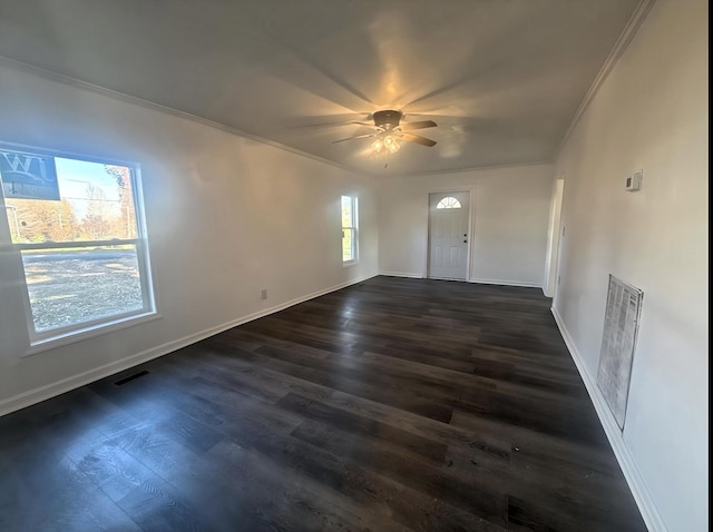 interior space featuring ceiling fan, dark hardwood / wood-style flooring, and ornamental molding