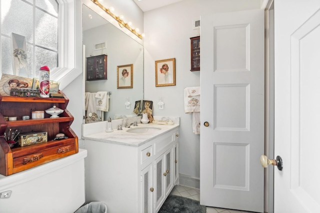 bathroom featuring tile patterned floors and vanity