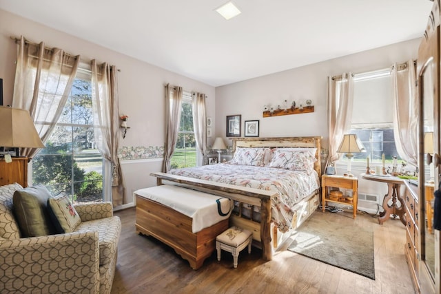 bedroom with hardwood / wood-style flooring