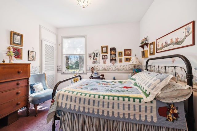 carpeted bedroom featuring a closet