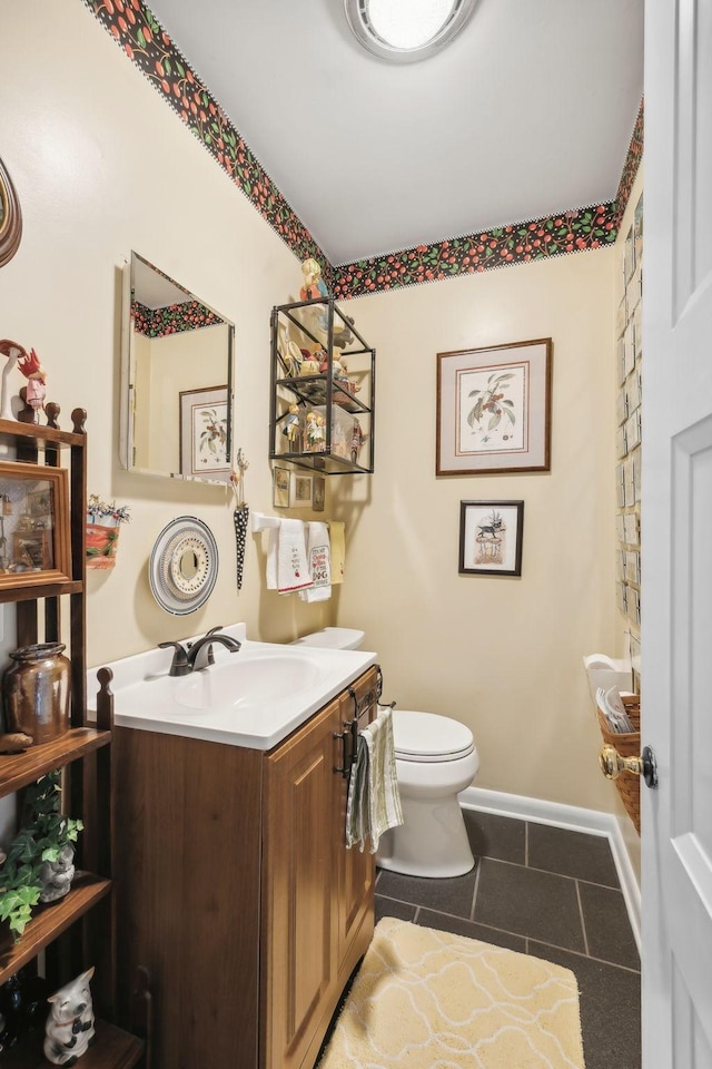 bathroom featuring tile patterned floors, vanity, and toilet