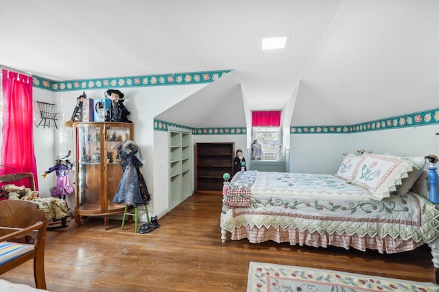 bedroom with hardwood / wood-style floors