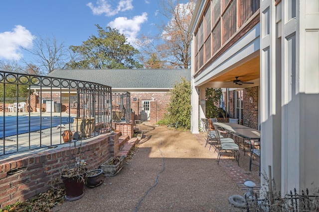 view of patio / terrace featuring ceiling fan