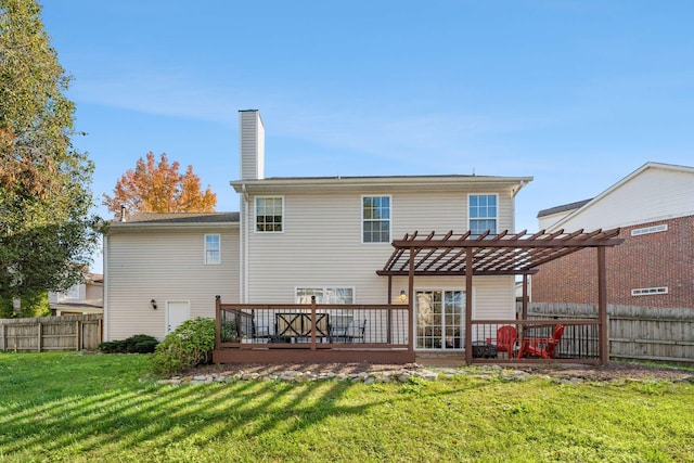 rear view of property with a yard, a deck, and a pergola