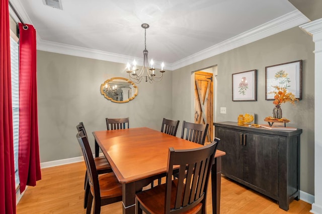 dining area with ornate columns, ornamental molding, a chandelier, and light wood-type flooring