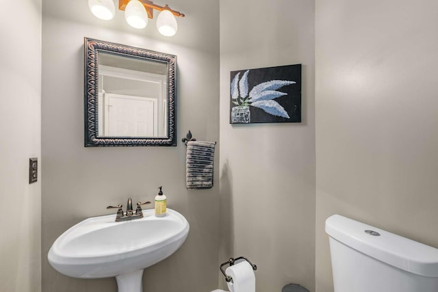 bathroom with toilet and sink