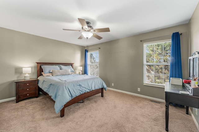 bedroom with light colored carpet and ceiling fan