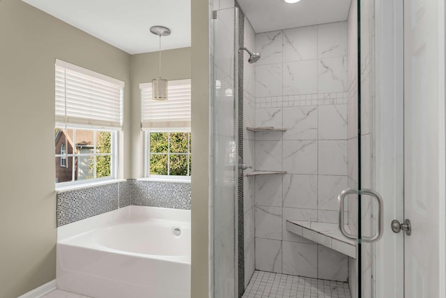 bathroom with tile patterned floors and independent shower and bath