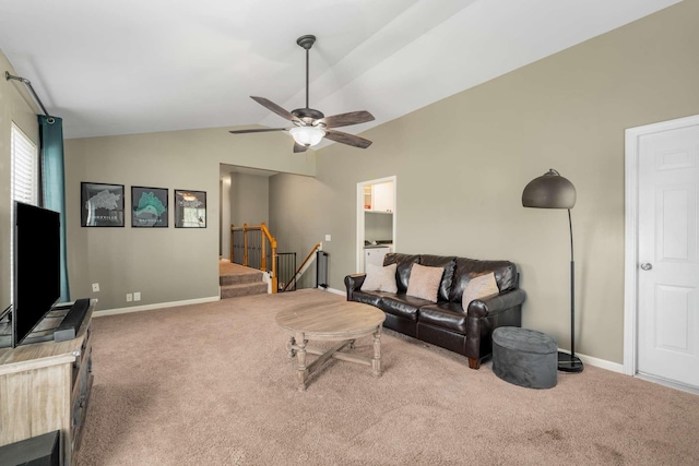 living room featuring carpet flooring, ceiling fan, and lofted ceiling