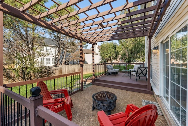 view of patio / terrace featuring a pergola, a deck, and an outdoor living space with a fire pit