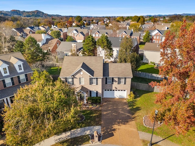 birds eye view of property with a mountain view