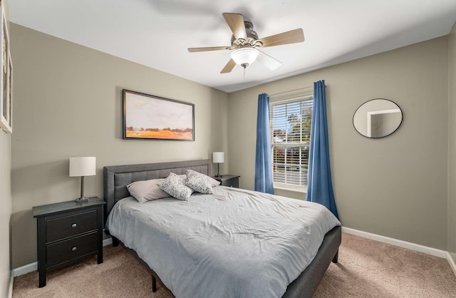 bedroom featuring ceiling fan and light colored carpet