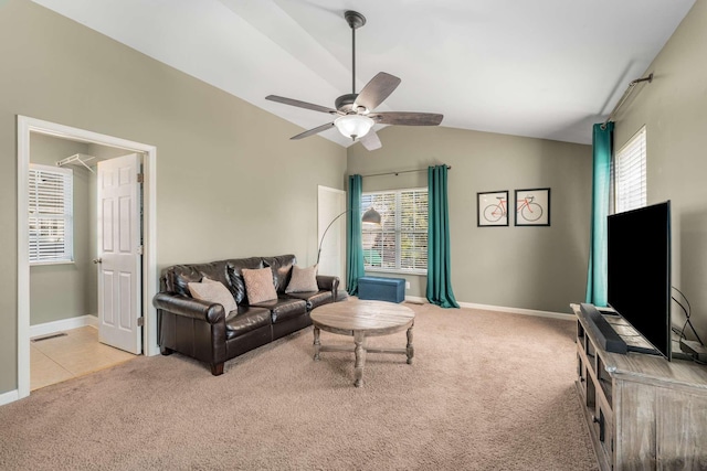 living room featuring ceiling fan, light colored carpet, and vaulted ceiling