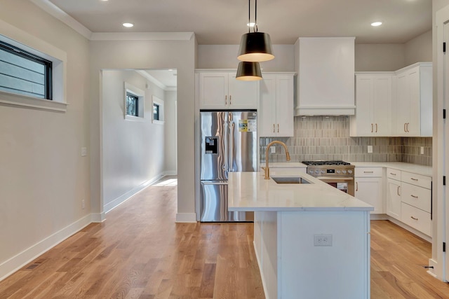 kitchen featuring white cabinets, appliances with stainless steel finishes, and sink