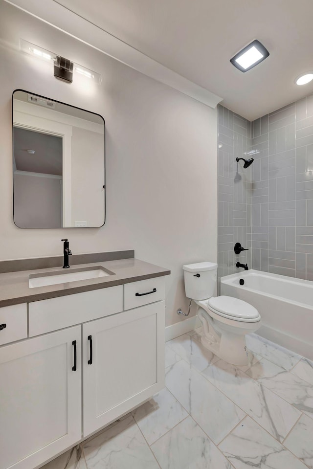 full bathroom with toilet, tiled shower / bath, and vanity