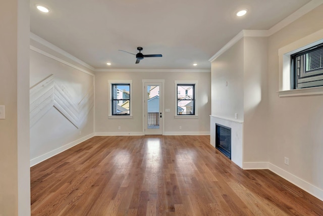 unfurnished living room with ceiling fan, light hardwood / wood-style flooring, and ornamental molding