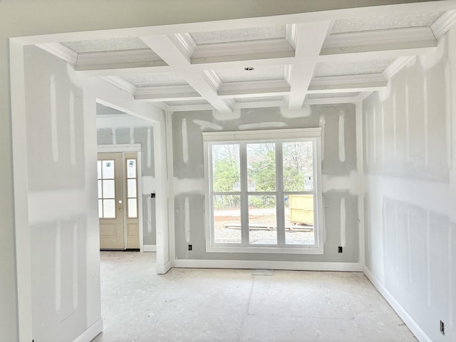 doorway featuring ornamental molding, coffered ceiling, and a wealth of natural light