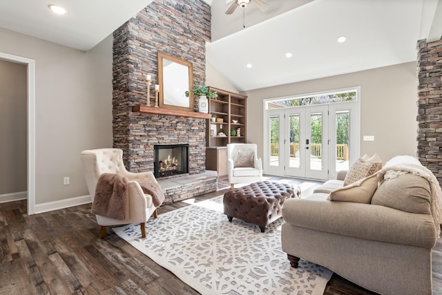 living room featuring high vaulted ceiling, french doors, dark hardwood / wood-style floors, ceiling fan, and a fireplace