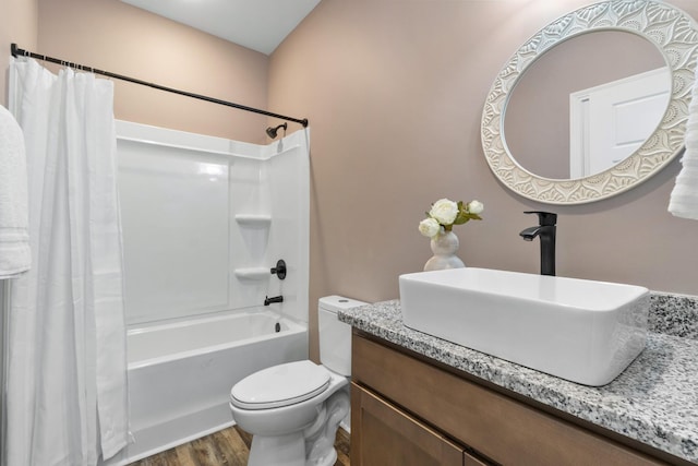 full bathroom with vanity, toilet, wood-type flooring, and shower / tub combo with curtain