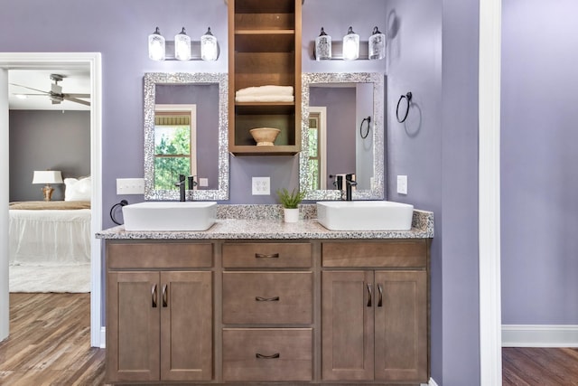 bathroom featuring wood-type flooring, vanity, and ceiling fan