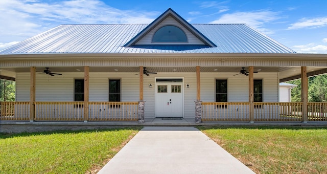 view of front of property with covered porch and a front yard