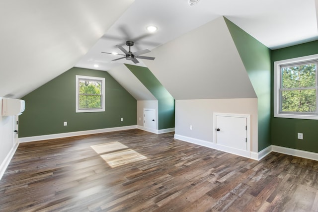 bonus room featuring ceiling fan, dark hardwood / wood-style flooring, and lofted ceiling