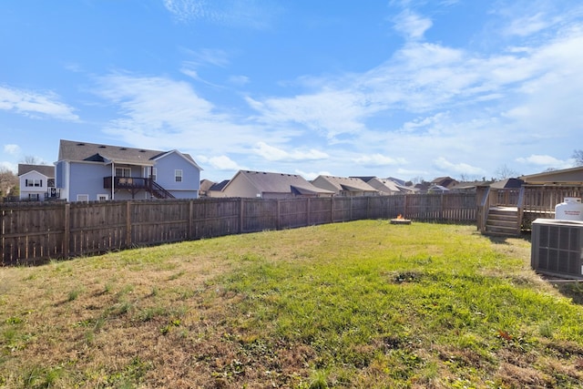 view of yard with a deck and cooling unit