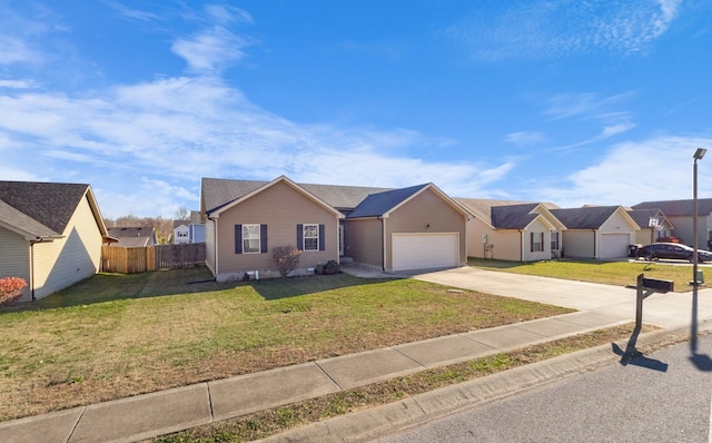 ranch-style home featuring a garage and a front lawn