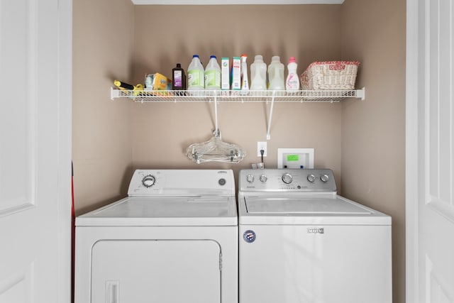 washroom featuring washer and dryer