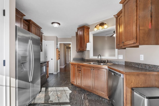 kitchen with ceiling fan, sink, and stainless steel appliances