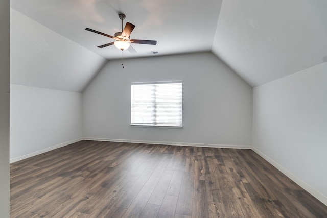 additional living space featuring ceiling fan, dark hardwood / wood-style flooring, and lofted ceiling